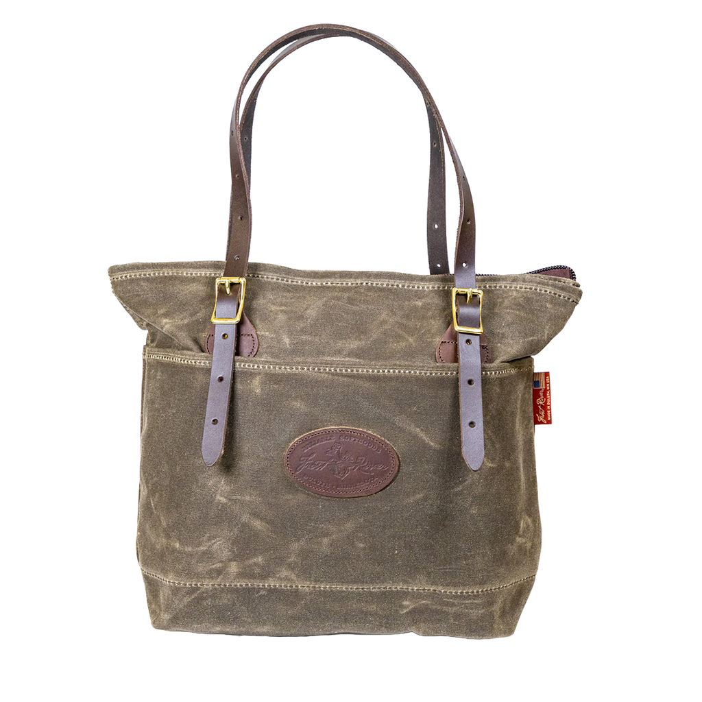 Waxed canvas and leather tote bag designed for everyday use.
