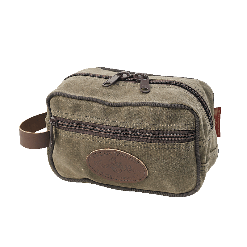 A crafted waxed canvas dopp kit or travel kit designed for toiletries but could be used for anything.