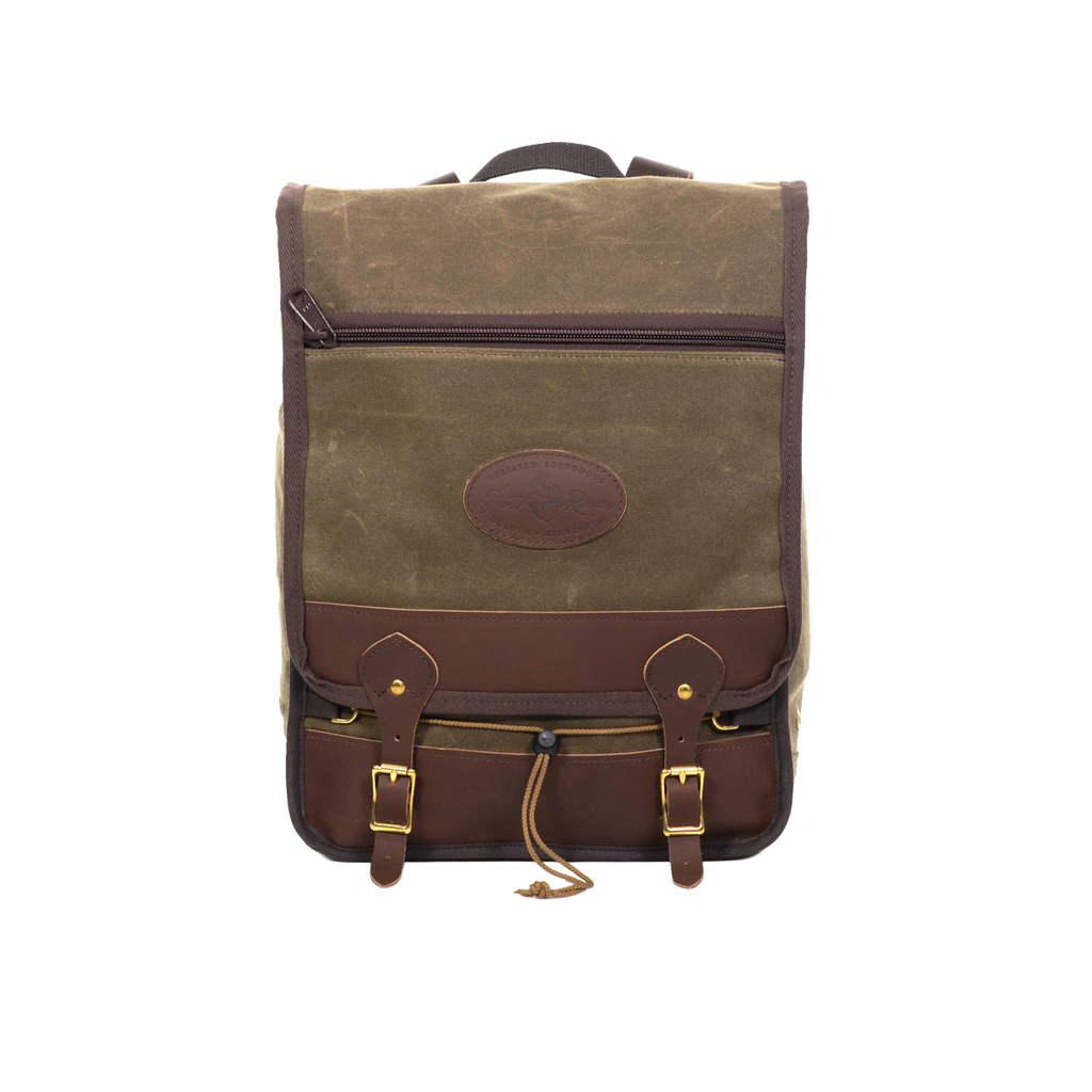 Waxed canvas and leather backpack perfect for carrying laptops and other daily essentials. 