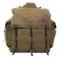 Traditional style waxed canvas canoe pack with two side pockets and a traditional style canoe pack. 
