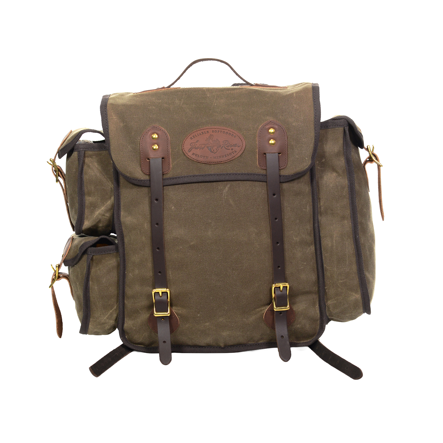 A waxed canvas backpack with dark brown leather straps and trim, featuring a central flap pocket with brass-tone buckles and a circular leather logo patch.