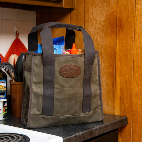 Lake Huron Tote sits on counter full of supplies. 