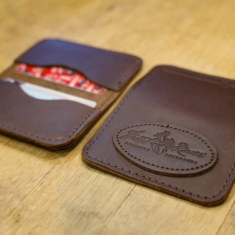 Either side is sized for standard credit cards and lD. Materials sourced within the USA, handcrafted in Duluth MN, and made by Frost River Trading Co.