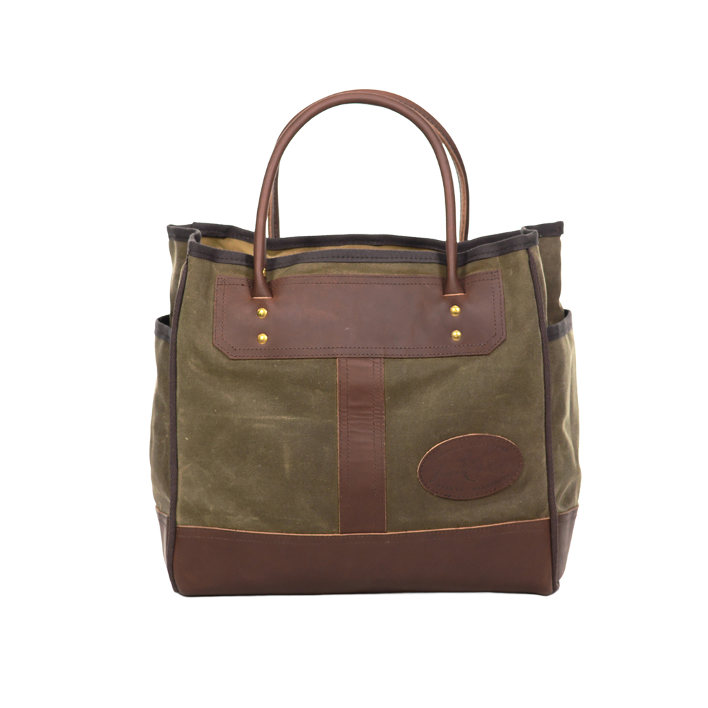 Handcrafted tote with premium rolled leather handles.
