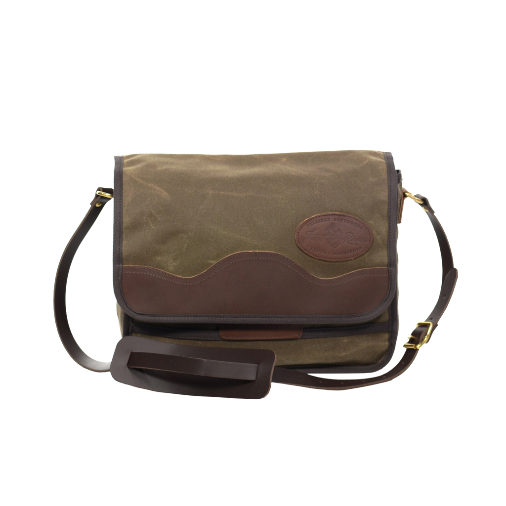 This small satchel is handcrafted out of high quality waxed canvas, premium leather, strong webbed cotton, and sold brass. 