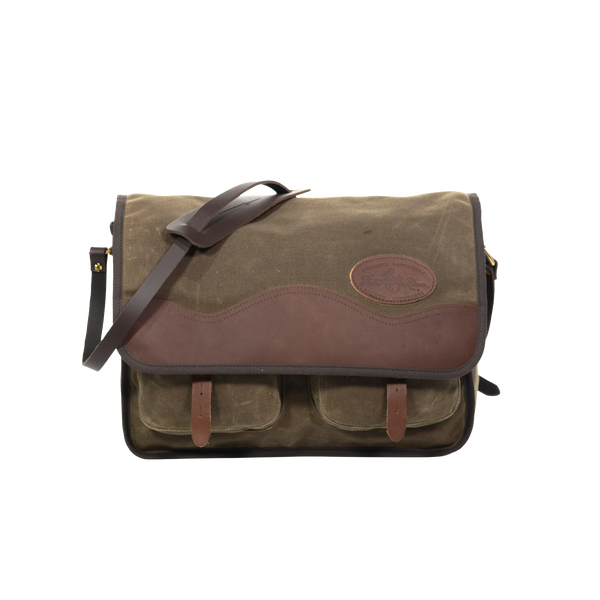 The larger sibling of the Little Manitou Shoulder Bag, still handcrafted out of high-end waxed canvas, premium leather, strong webbed cotton, and solid brass.