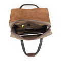 The inside of a waxed canvas and leather briefcase showing off it's organizational panels and pockets. 