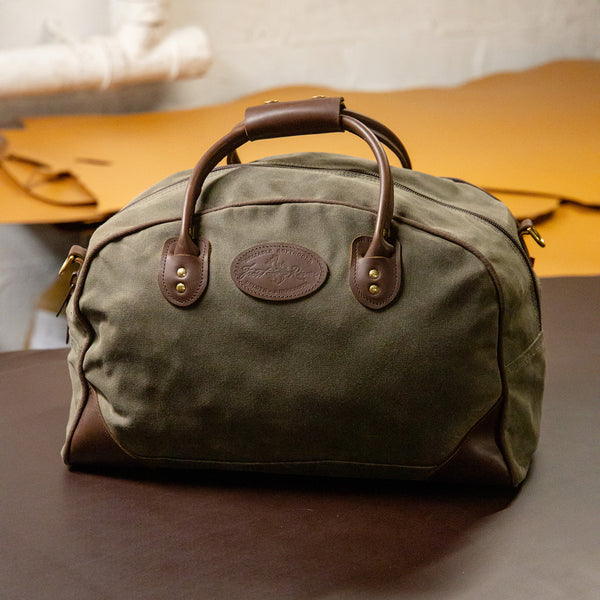 Frost River's Flight Bag duffel that is made from waxed canvas and leather. 