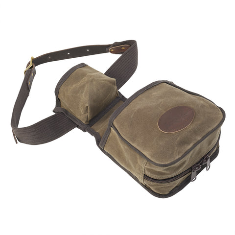 The bottom of this waxed canvas sporting clays shooting bag has zippers for quick unloading of spent shells.