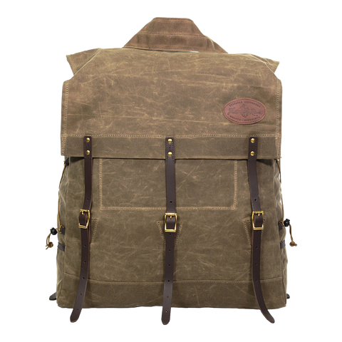 A traditional style canoe pack made from waxed canvas and leather featuring a tumpline. 