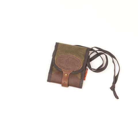 Made with waxed canvas, premium leather, and solid brass.